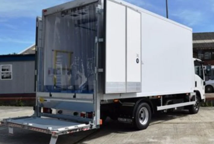 A JD refrigerated rigid truck with its rear doors and tail lift open